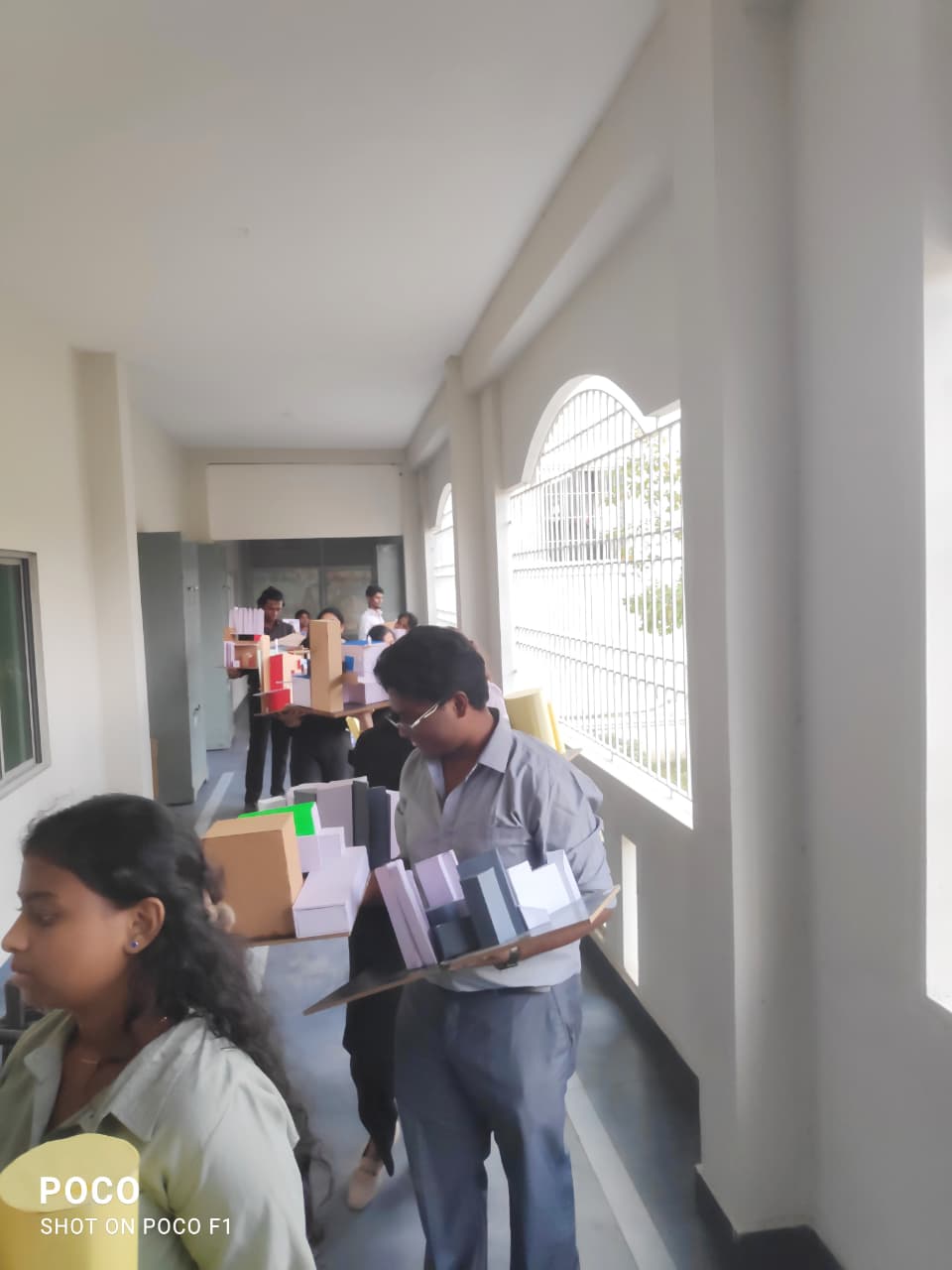 Students Carrying Models